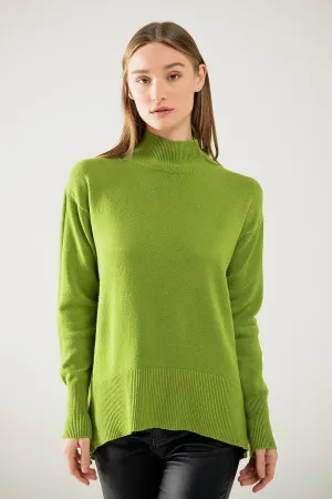 Loose green sweater with opening in the back
