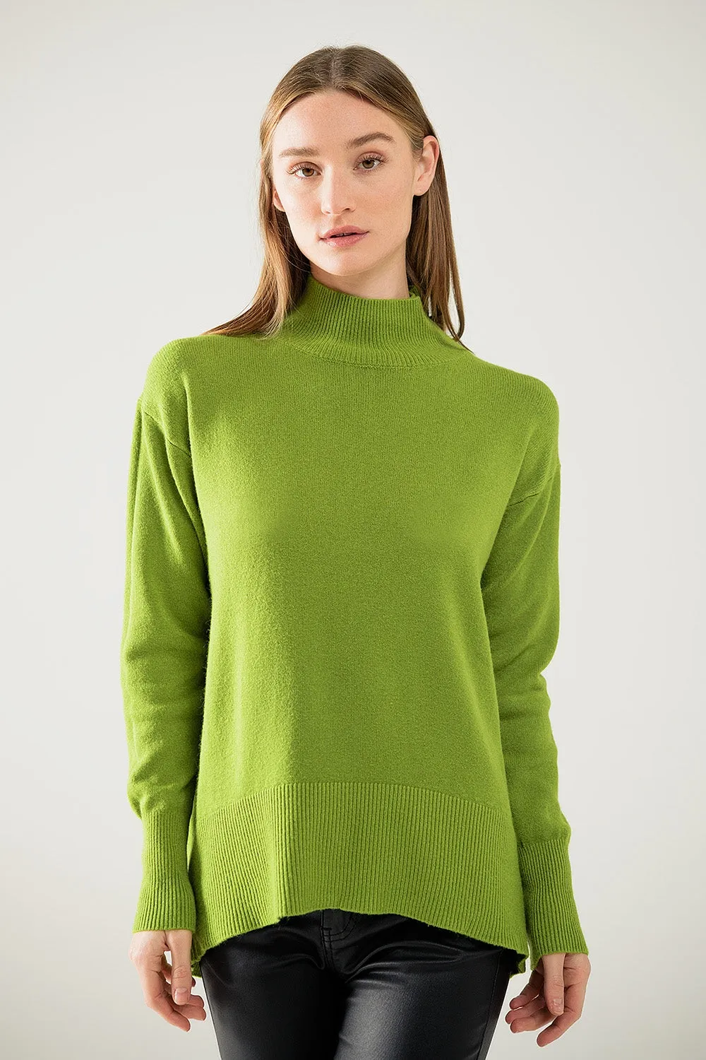 Loose green sweater with opening in the back